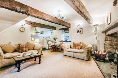 Lavender sitting room with log burner