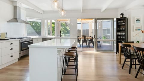Large light filled modern kitchen with breakfast bar