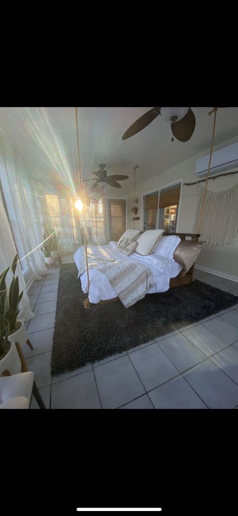 Cozumel Bedroom # 4 - my favorite! Queen swinging bed private with trees in back