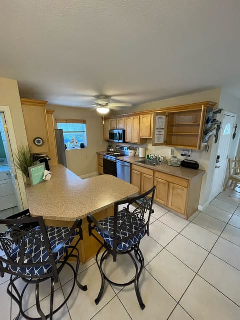 Kitchen and additional counter seating w/stainless steel appliances