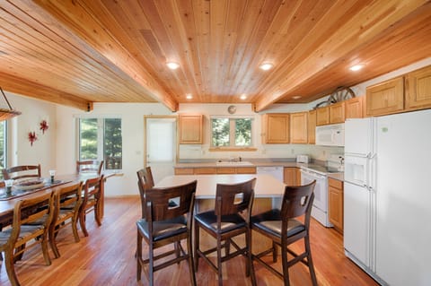 Well lit kitchen.  Nice work space and counter seating.