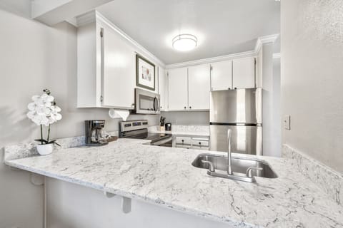 Kitchen. Exact unit will be assigned upon arrival. Views, colors, and decor may vary.