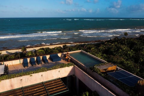 Rooftop infinity pool with breathtaking Caribbean Sea views