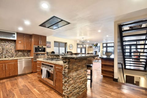 Another View of the Kitchen Island with Oven and Cooktop, plus Breakfast Bar on Main Level (2nd)