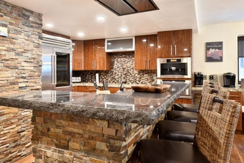 Beautiful Stone Breakfast Bar Seating for Four on Main Level (2nd)