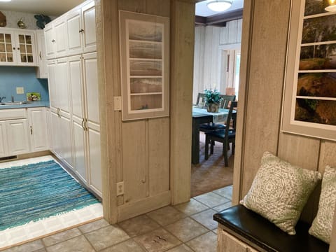 View of  kitchenette and dining room from entranceway foyer