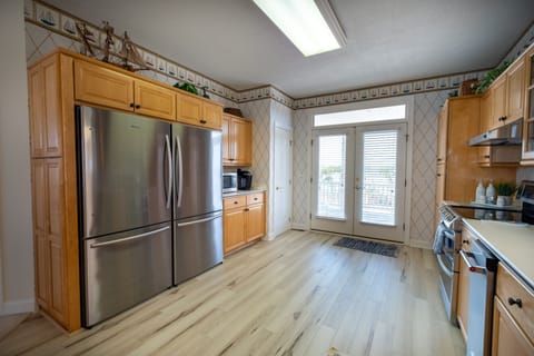 Kitchen with double stainless steel refrigerators and under counter ice maker