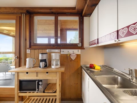 Wood, Interior Design, Kitchen, Furniture, Flooring, Floor, Room, Cabinetry, Countertop, Ceiling