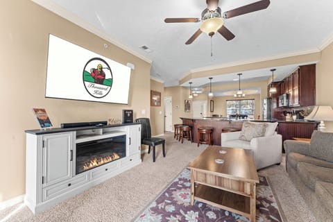 Living Room with Sofa Bed, Cable TV, Electric Fireplace, and Sunroom access