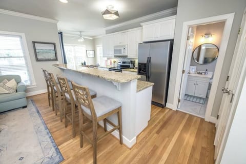 Open concept kitchen with breakfast bar for additional seating.