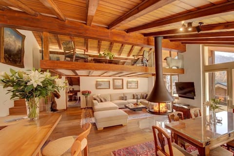 Open plan living and dining area with upper gallery