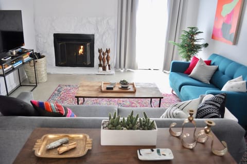 Living room with gas fireplace and large television that gives you acess to your Netflix, Hulu and Amazon Prime Video accounts.