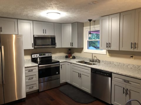 new granite kitchen with stainless appliances