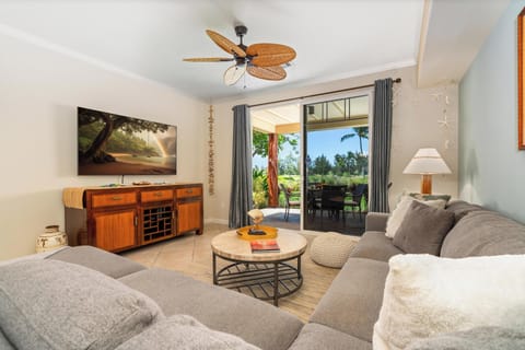 Bright, spacious living room with sliding doors to lanai