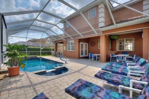 Covered patio seating area at Sunset Corner Retreat by Shine Villas