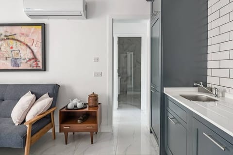 living - kitchen leading onto bathroom and bedroom