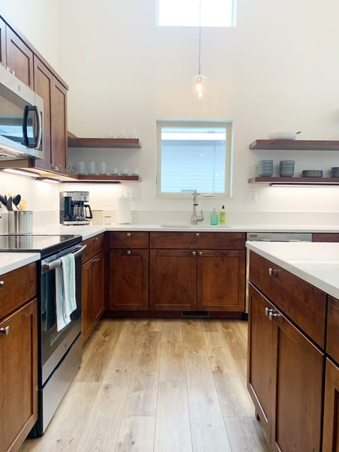 Fully stocked kitchen with large island and lots of prep space