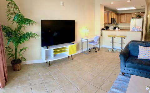 A small laptop desk for any browsing or work along with adjustable bar stools