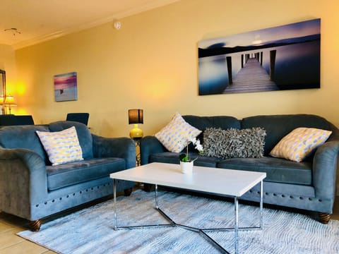 Very clean and spacious living room with a queen sofa bed