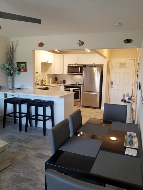 Dinner seating for 4, along with 2 bar stools.