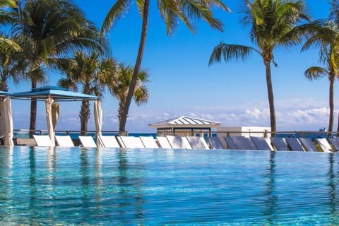 Slip into sparkling infinity waters with breezy palm views.