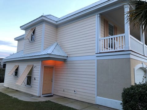 Side entrance to lower level, and outside shower to left of door