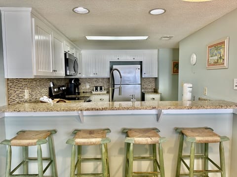 Seating for 4 at the kitchen bar.