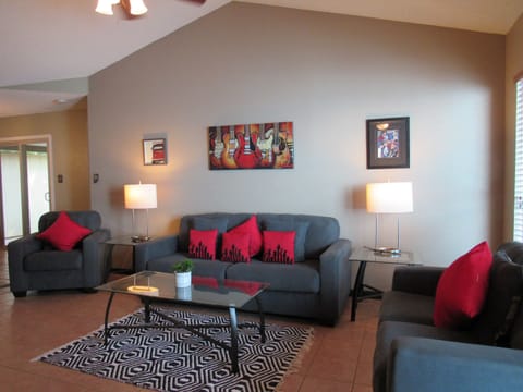 Austin music themed living room with fireplace and SmarTv above the mantle