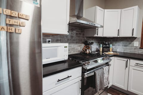 Microwave. Kettle. Utensils. Knives. Is anyone reading these captions?