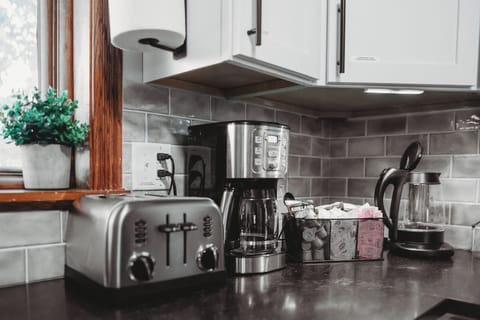 Toaster, drip coffee maker, pour over, kettle, filters, various sweeteners.