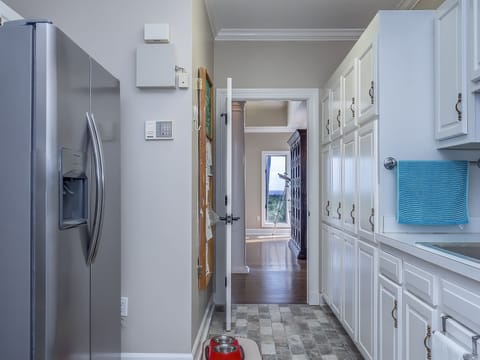 Oversized laundry room with additional refrigerator