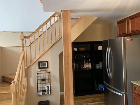 Open pantry for guest storage.  Small beverage fridge in addition to Wolf fridge
