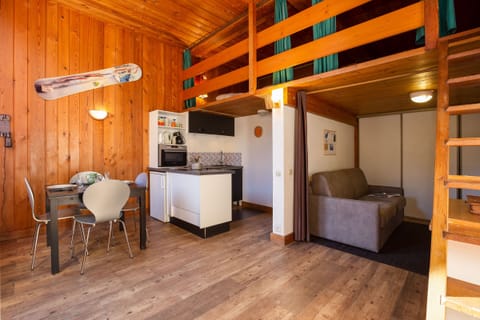 Open living space with double sofa bed and mezzanine bedroom