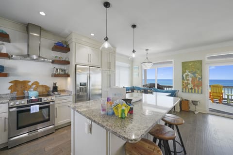 Full kitchen with 3 barstools