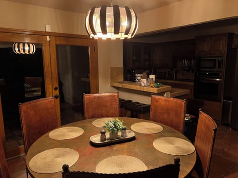 Custom built copper lamp, copper table and real leather chairs
