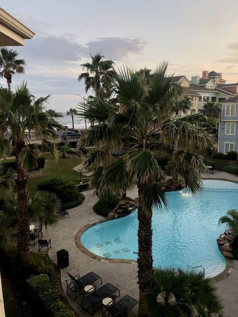 View from our 3rd story balcony - beach and pool.
