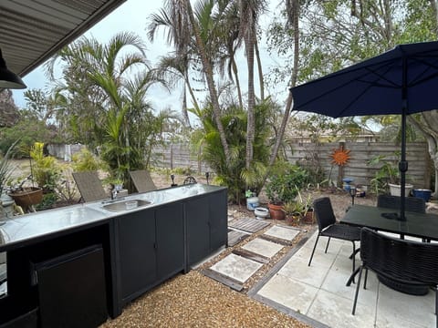 Private backyard with grill, outdoor dining and a spot to relax w a good book.