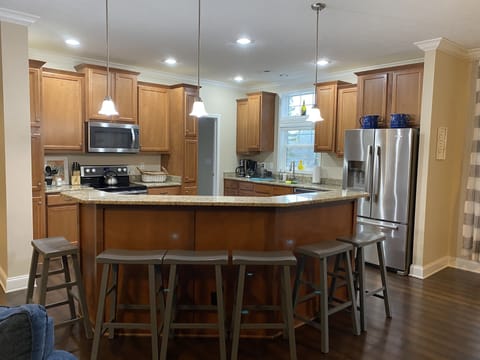Kitchen has 2 refrigerators, one is in pantry behind kitchen