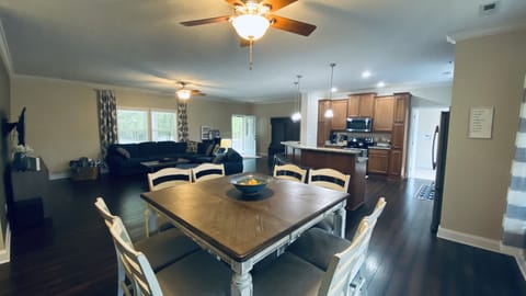 Fits 8 at the dining room table and 6 on stools with more space on the porch 