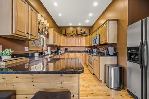 Bright, fully stocked kitchen with modern finishes. Perfect for cooking and gathering.