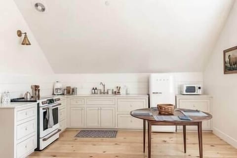 Fully operational kitchen! Smeg refrigerator, GE range, microwave, toaster, Smeg coffee maker.