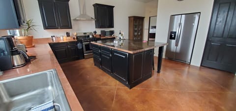 Kitchen from within; note island & pantry