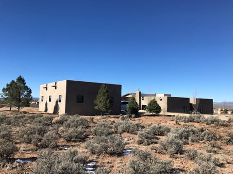 garage with house in the background (from golf course drive) just inside CC gate