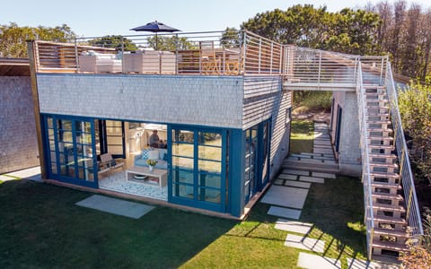 Walk up the stainless steel staircase to the second floor roof top deck.