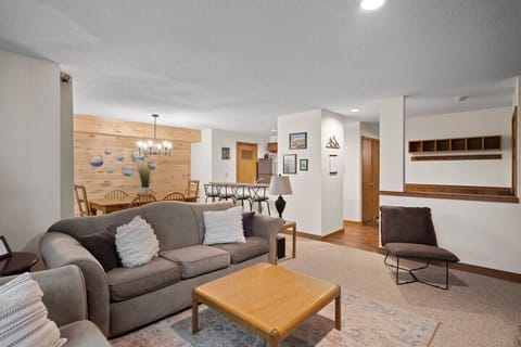 Open concept living room, dining room, kitchen, and mudroom.