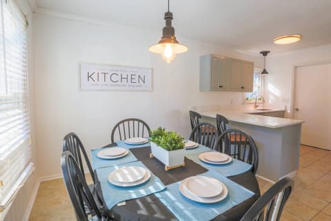 The dining room connects to both the kitchen and the living room.