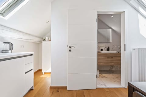 Elegance meets simplicity – your serene bathroom retreat just steps away.