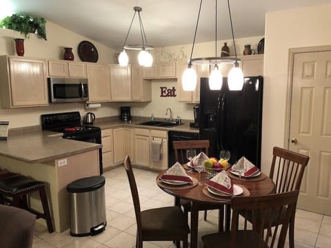 Kitchen adjoins living room.  Open & well-lit.  Seats 6. 