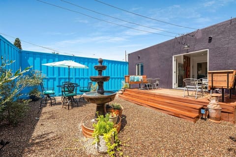 Private backyard with a tiered fountain, deck and bistro dining