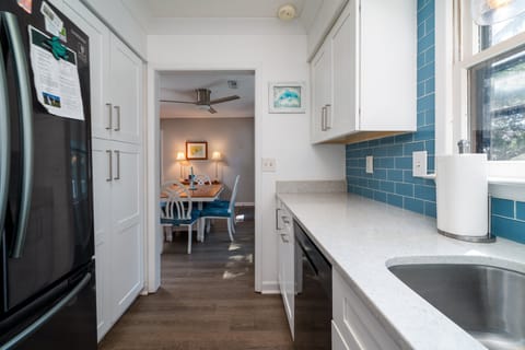 The kitchen sits to the left of the front entrance and dining area